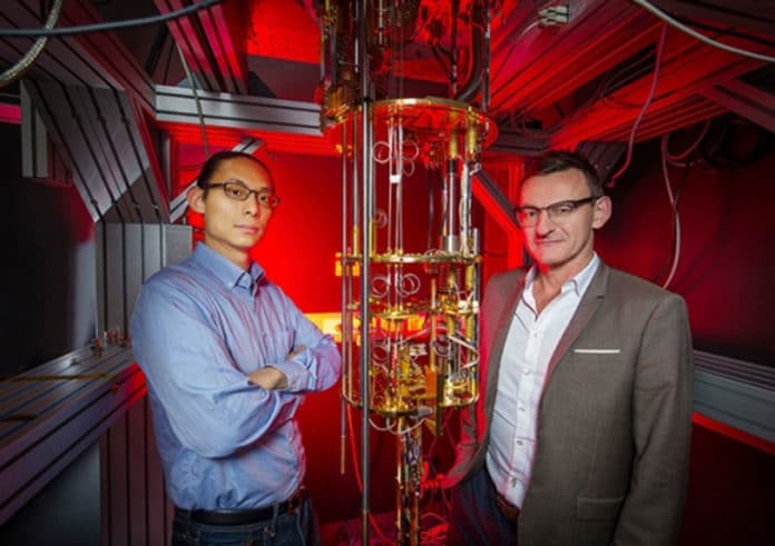 Dr Henry Yang and Professor Andrew Dzurak with a dilution refrigerator designed to keep qubits operating at extremely cold temperatures. Picture: UNSW Sydney