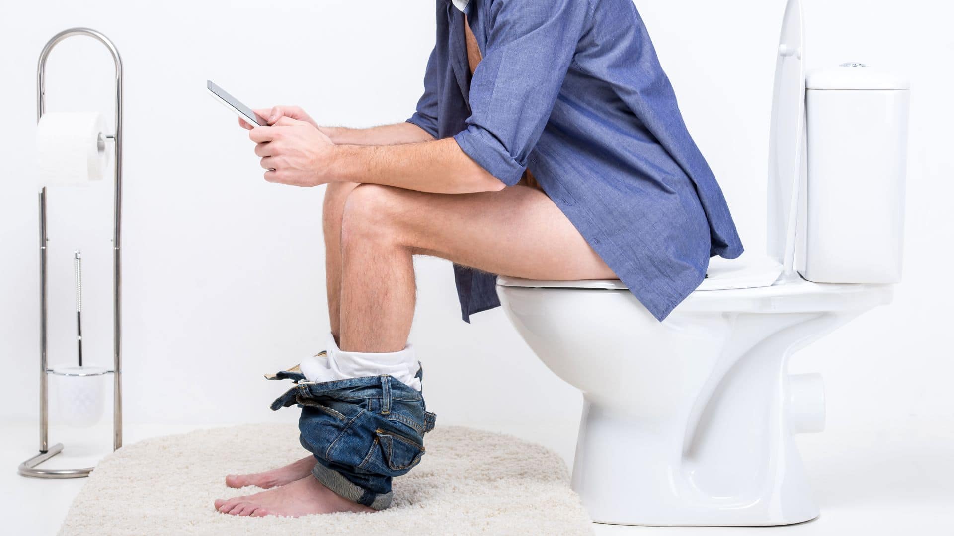Image showing man sitting on toilet using mobile