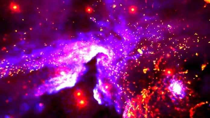 Combining data from Chandra and other telescopes with supercomputer simulations and virtual reality, a new visualization allows users to experience 500 years of cosmic evolution around the Milky Way's supermassive black hole called Sgr A*. Each color represents different phenomena including Wolf-Rayet stars (white), their orbits (grey), and hot gas due to the supersonic wind collisions observed by Chandra (blue and cyan). There are also regions where cooler material (red and yellow) overlaps with the hot gas (purple). The visualization covers about 3 light years, or about 18 trillion miles, around Sgr A*.