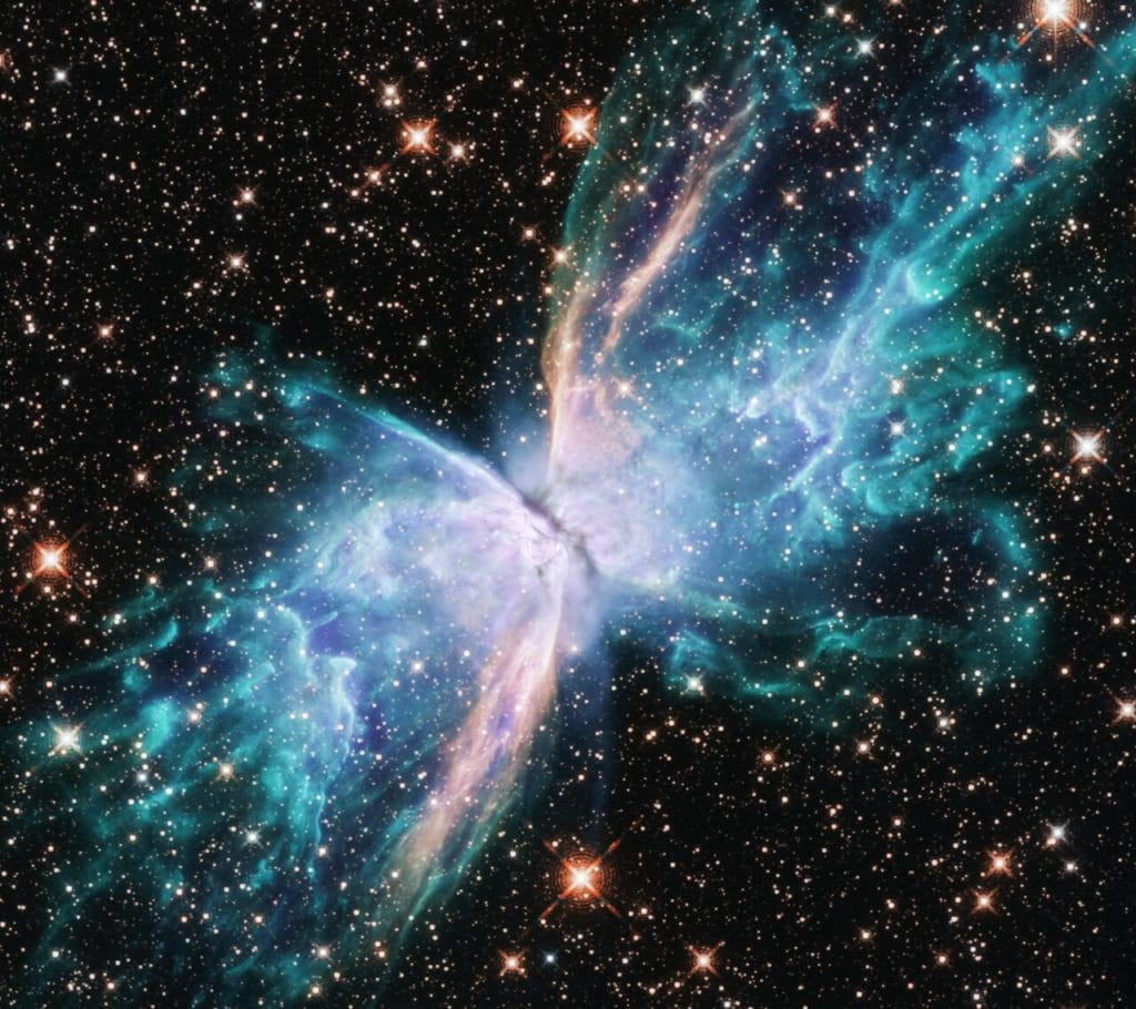 This image from the NASA/ESA Hubble Space Telescope depicts NGC 6302, commonly known as the Butterfly Nebula. NGC 6302 lies within our Milky Way galaxy, roughly 3800 light-years away in the constellation of Scorpius. The glowing gas was once the star's outer layers, but has been expelled over about 2200 years. The butterfly shape stretches for more than two light-years, which is about half the distance from the Sun to the nearest star, Proxima Centauri. New observations of the object have found unprecedented levels of complexity and rapid changes in the jets and gas bubbles blasting off of the star at the centre of the nebula.