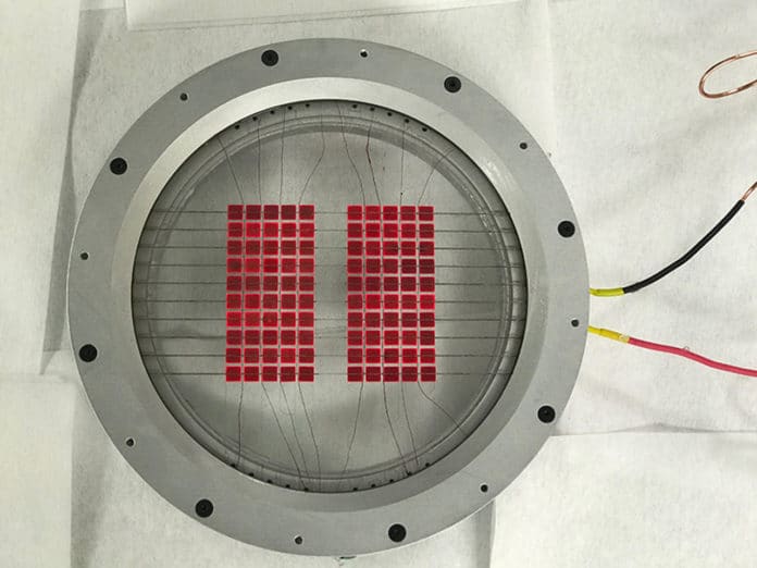 The hybrid solar energy converter features a solar module with glowing red cells built at Tulane.