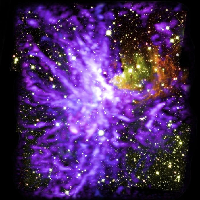 Image of star cluster G286.21+0.17, caught in the act of formation. This is a multiwavelength mosaic of more than 750 ALMA radio images, and 9 Hubble infrared images. ALMA shows molecular clouds (purple) and Hubble shows stars and glowing dust (yellow and red).
