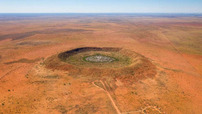 The newly discovered crater is thought to be five times bigger than Wolfe Creek Crater (pictured), one of the largest meteorite craters in the world
