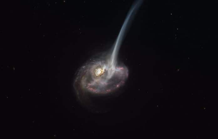 This artist’s impression of ID2299 shows the galaxy, the product of a galactic collision, and some of its gas being ejected by a “tidal tail” as a result of the merger. New observations made with ALMA, in which ESO is a partner, have captured the earliest stages of this ejection, before the gas reached the very large scales depicted in this artist’s impression.