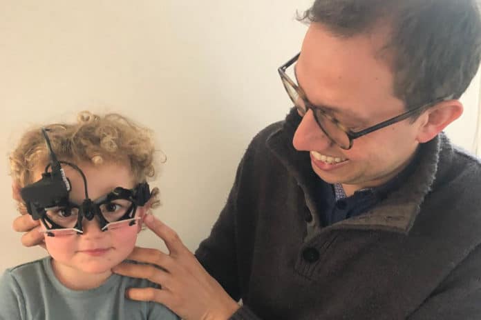 University of Canterbury Audiology Lecturer Dr Mike Maslin demonstrates the Video Head Impulse Test (vHIT) on his two-year-old son Theo Maslin.