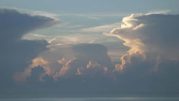 Towering cumulonimbus thunderstorm clouds