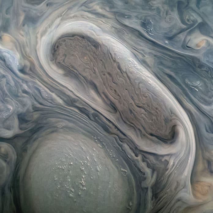 This JunoCam image shows two of Jupiter's large rotating storms, captured on Juno’s 38th perijove pass, on Nov. 29, 2021.