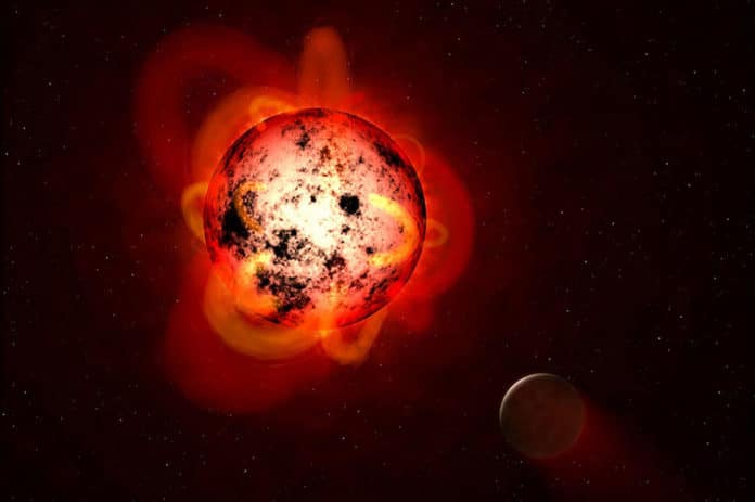 Caption:An illustration of a red dwarf star orbited by an exoplanet