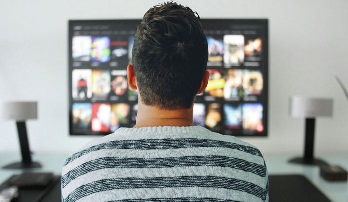 Image showing a man watching TV
