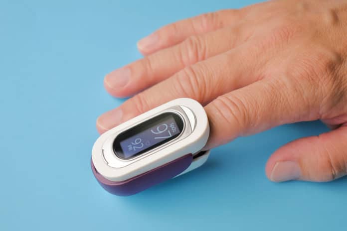 Image showing person's finger in pulse oximeter