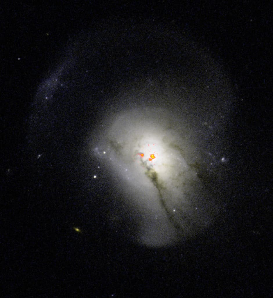 Post-starburst galaxies were previously believed to expel all of their molecular gas, a behavior that caused them to stop forming stars. New observations have revealed that these galaxies actually hold onto and condense star-forming fuel near their centers, and then don’t use it to form stars. Here, radio data of PSB 0570.537.52266 overlaid on optical images from the Hubble Space Telescope, show the dense collection of gas near the center of the galaxy.