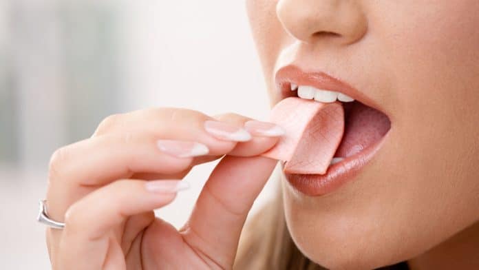 Image showing a woman chewing gum