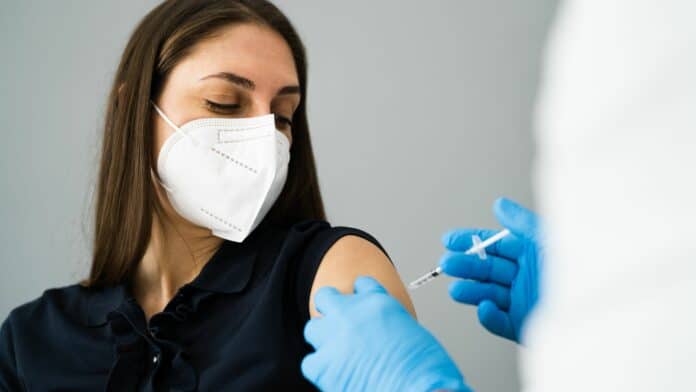 Image showing woman taking vaccine