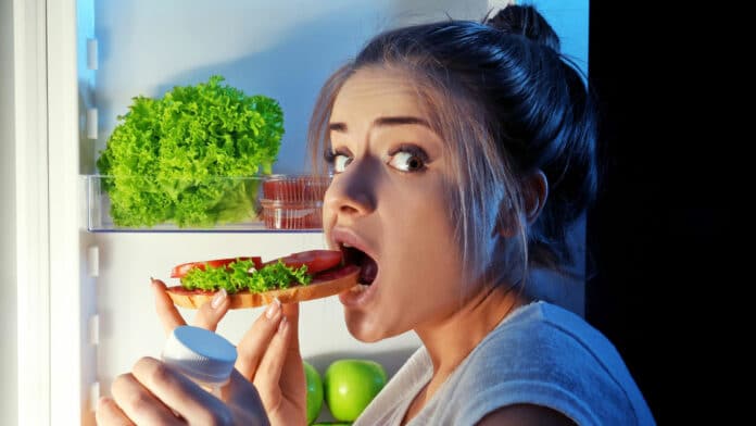 Image showing girl having late food