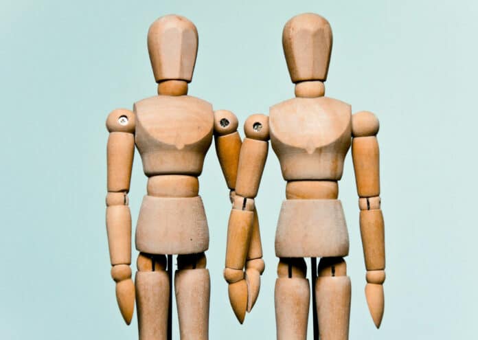 Wooden mannequin of same sex marriage