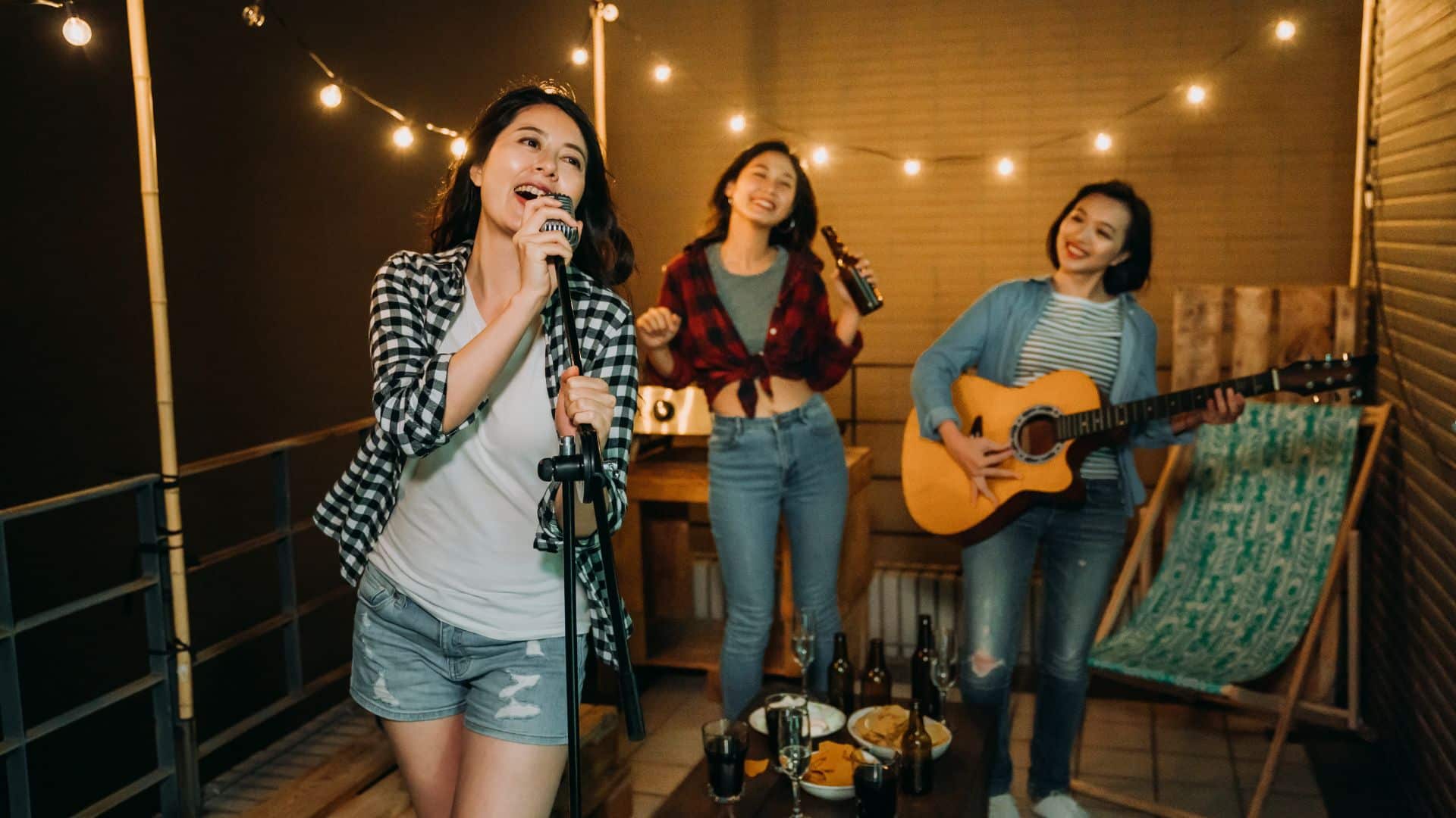 Three girls singing songs