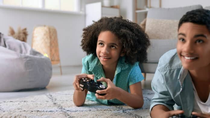 Image showing two teen holding video game remote