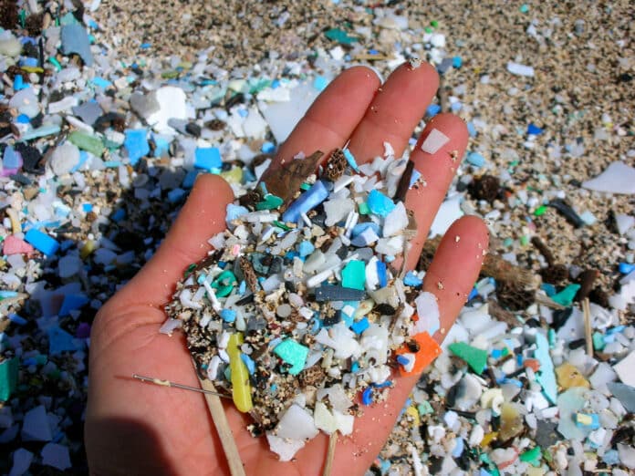 A handful of microplastics washed ashore at Kamilo Beach, Hawaii.