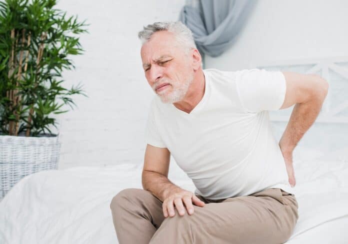 Image showing elder man with back pain.