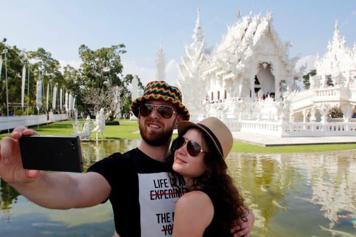 Image showing couple taking selfie.