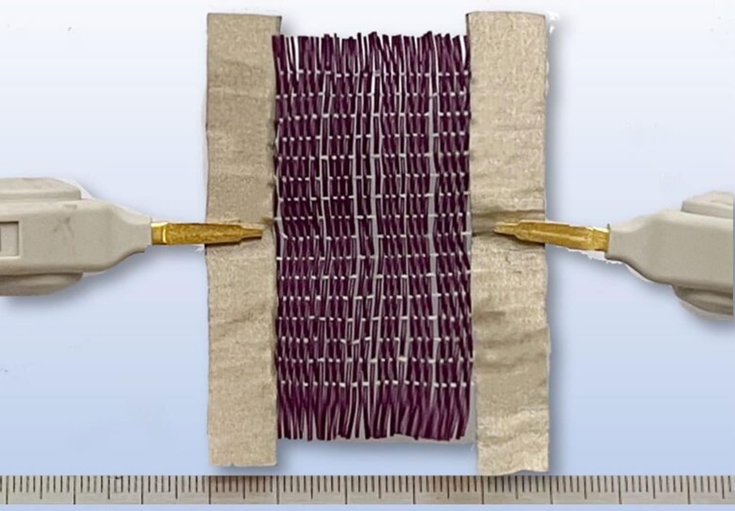 A new type of programmable smart fabric reacts to electricity and temperature thumbnail