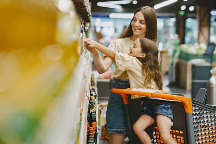 Image showing kid picking food in supermarket