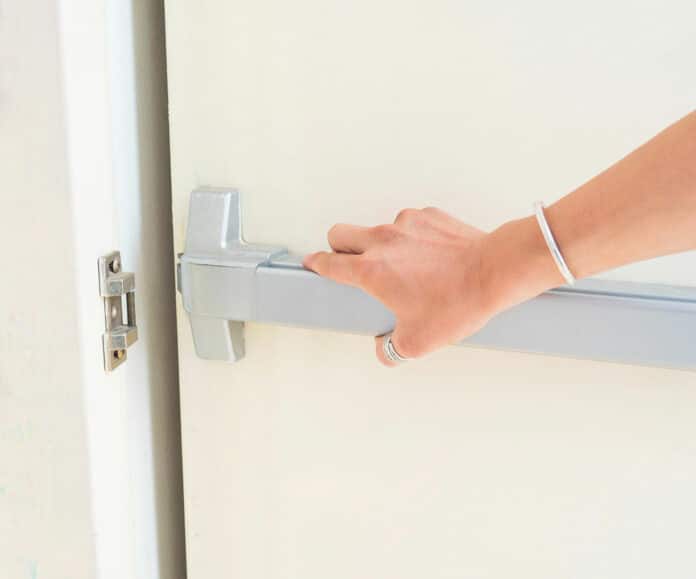 Image showing lady opening a door knob