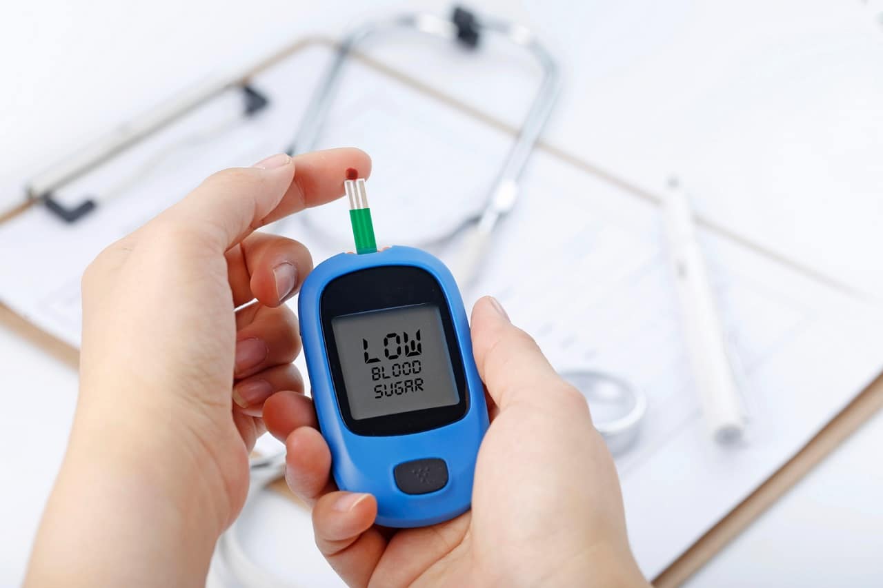 Image showing blood glucose meter measuring blood sugar.