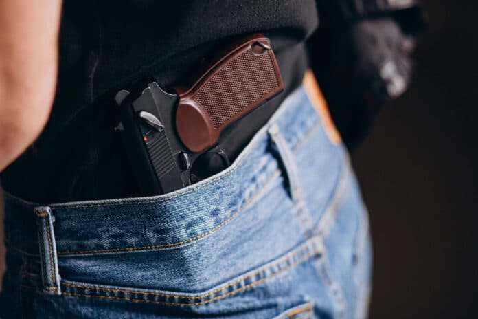 Image showing gun in man's pocket