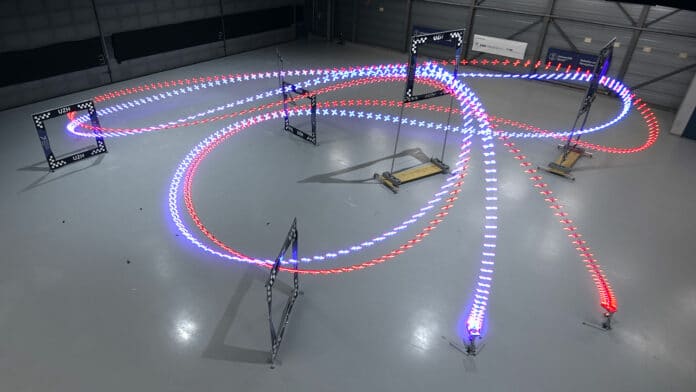 The AI-trained autonomous drone (in blue) managed the fastest lap overall, half a second ahead of the best time of a human pilot.