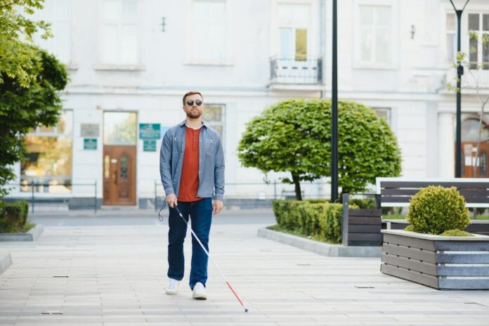 Blind man people with disability handicapped person and everyday life visually impaired man with walking stick