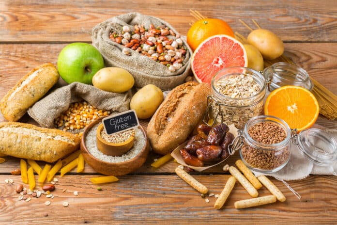 Assortment of gluten free food on a wooden table