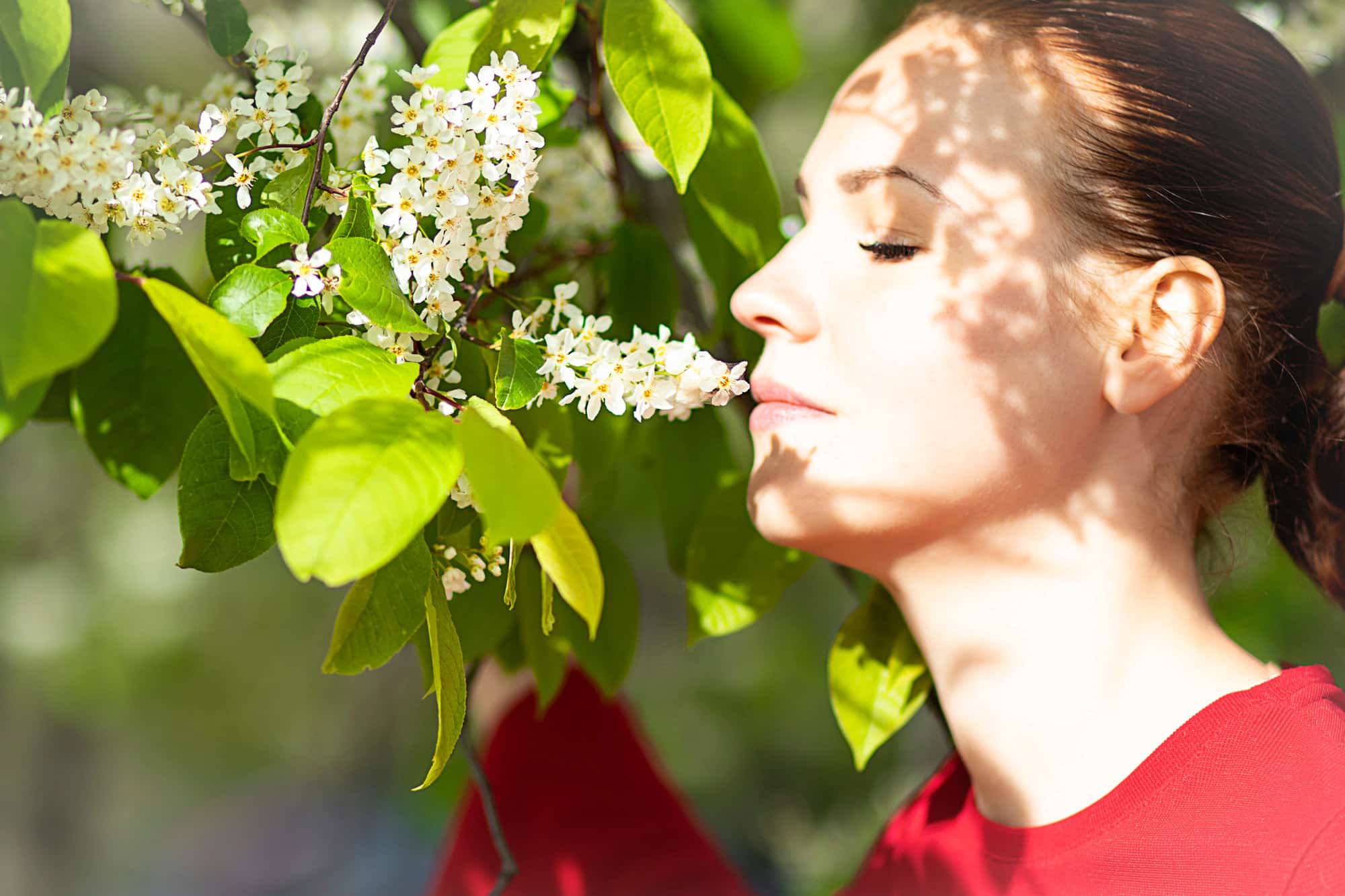 Image showing woman smelling flower