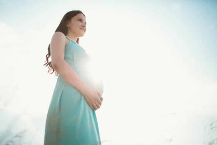 Image showing pregnant woman in sunlight