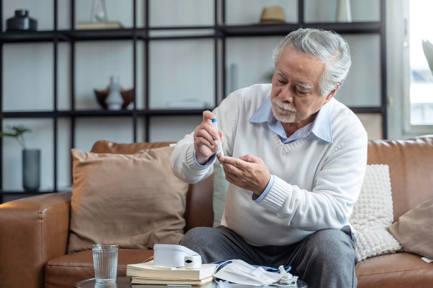 Old senior asian male hand nasal swab testing rapid tests