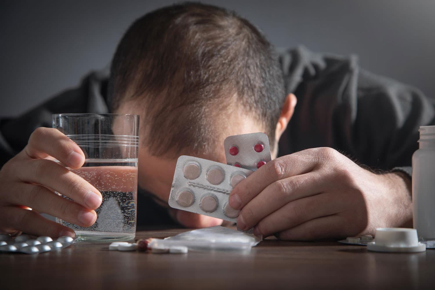 Caucasian depressed man with a pills