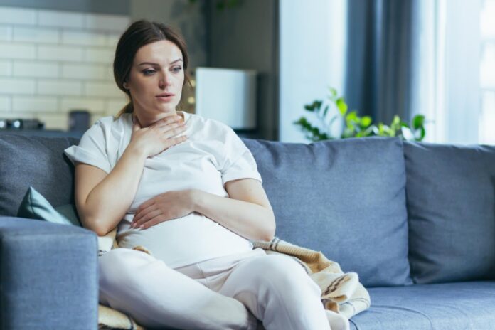 Pregnant lady sitting on couch