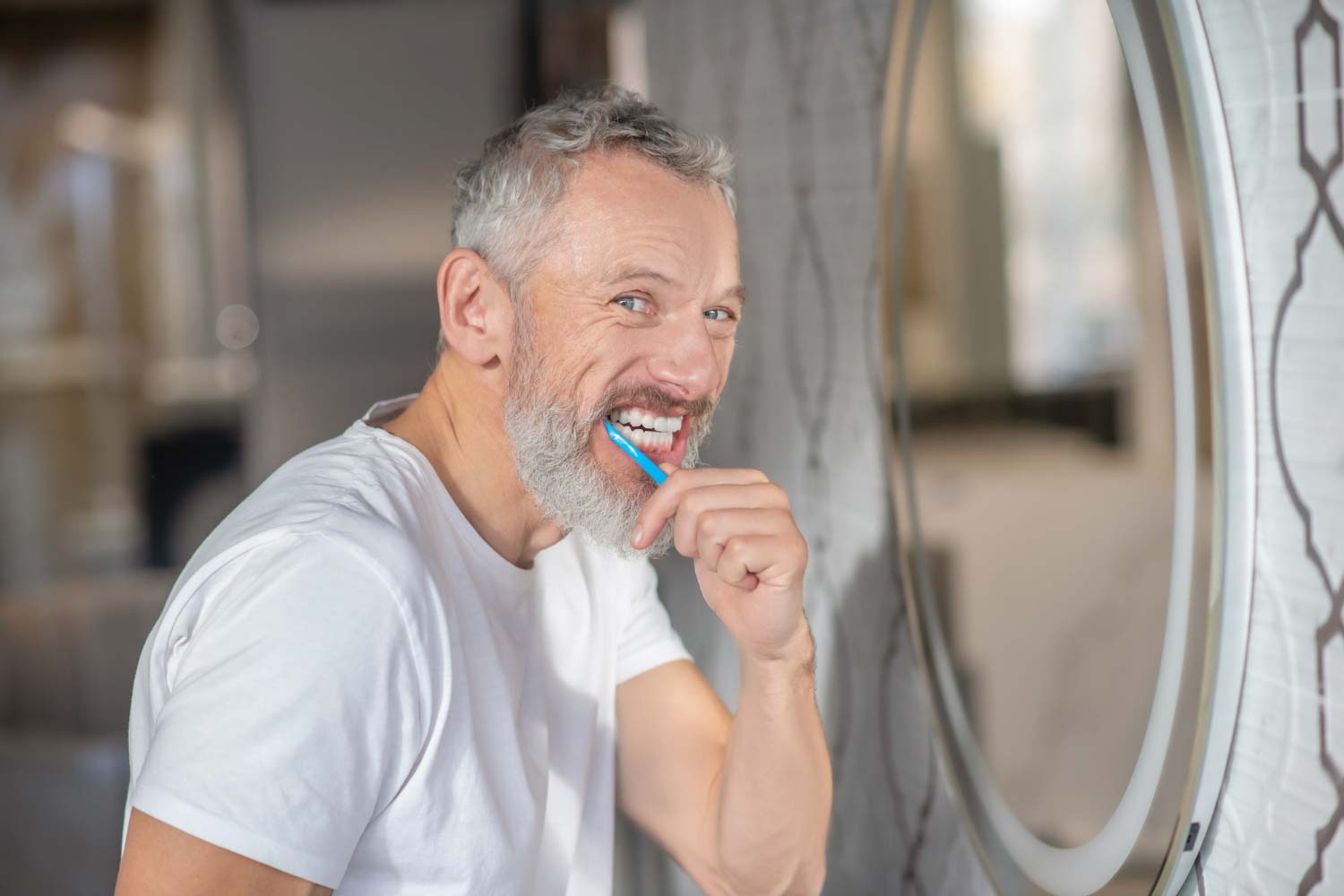 Healthy teeth. a man brushing his teeth with a new toothpaste