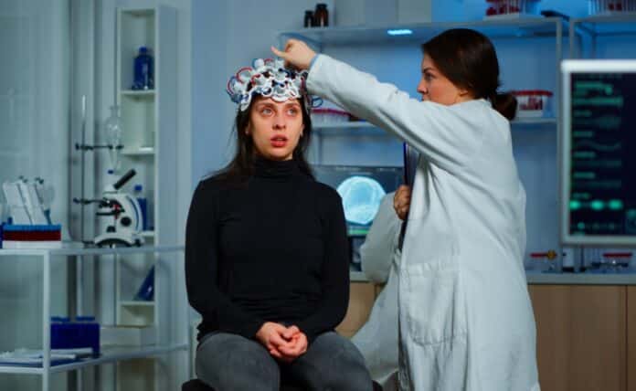 Doctor researcher adjusting eeg headset analyzing patient's evolution after