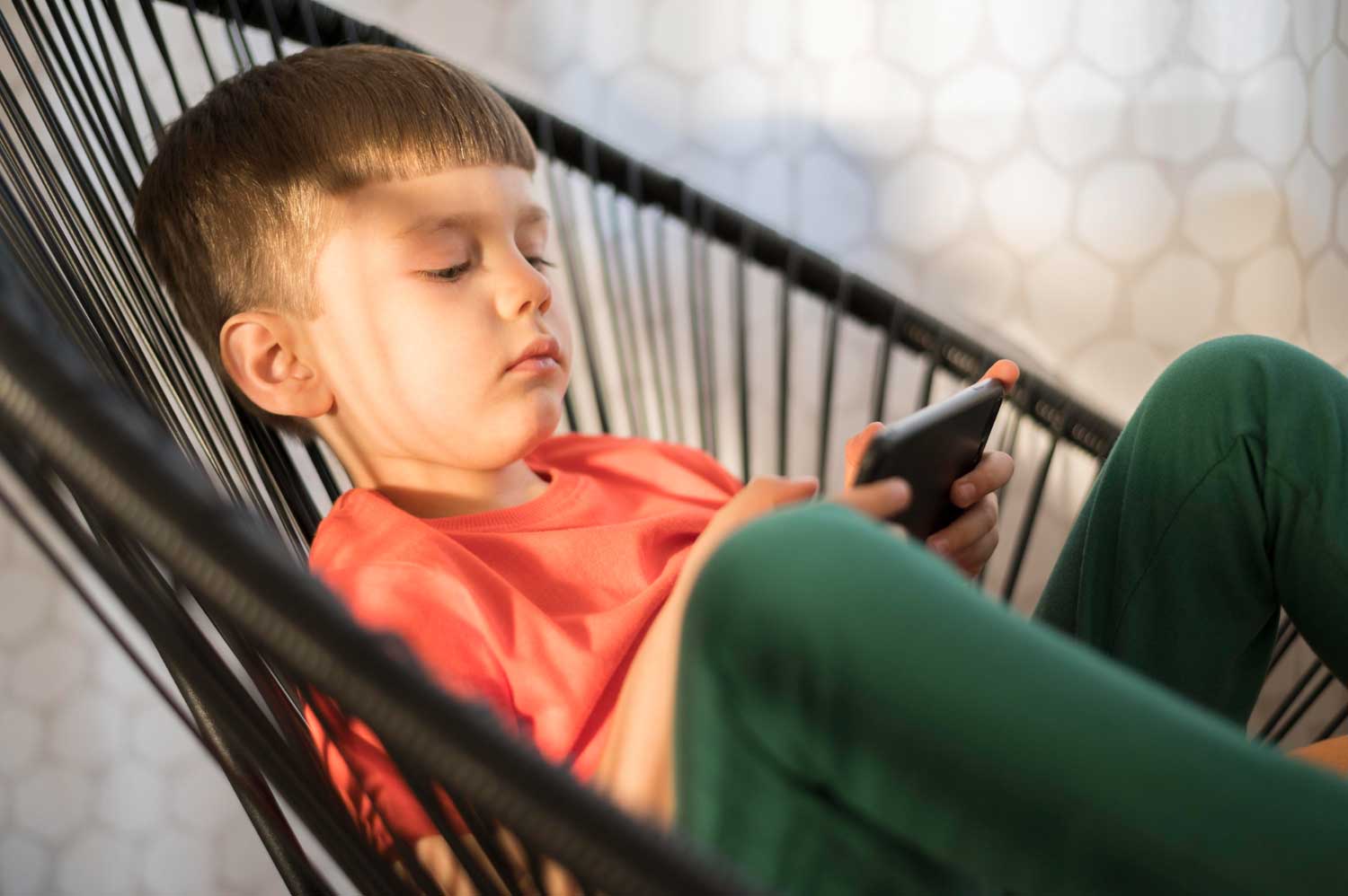 High angle boy with tablet playing