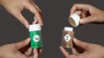 mit-shift-lens A new 3D printing system created by MIT researchers enables users to produce interactive objects like this chemical bottle, which change their appearance when they are pressed, slid, or turned, without the use of any internal electronics